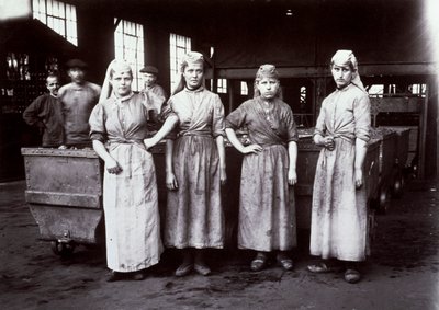 Portrait of four young female workers, employed to grade coal at the mining establishment of Leus, France, 1896 by French Photographer